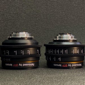 May include: Four black camera lenses with silver accents and gold rings. Each lens has the text "Rehoused by BTF lenses" printed on the side.