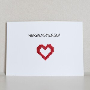 Carte postale *Herzensmensch* avec motif en perles thermocollantes