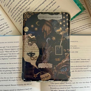 May include: Transparent phone case with a dark blue celestial design featuring stars, moons, and vintage illustrations. The case has a collage of images, including a hand, eye, and text that reads "Fairy Dust."