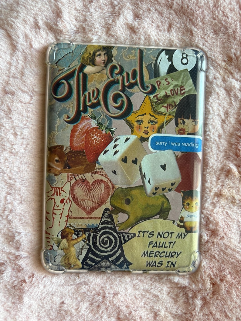 May include: Clear phone case with a collage design. The design includes the words "The End", a crying star, dice, a frog, and the text "IT'S NOT MY FAULT! MERCURY WAS IN". Other elements include a strawberry, a heart, and an angel.