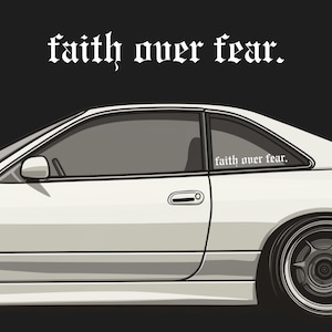 May include: White sports car illustration with the text "faith over fear" in a gothic font. The car is viewed from the side, showcasing the door, window, and wheel. The phrase is also on the rear window.