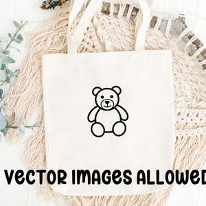 May include: Cream-colored tote bag with a black outline of a teddy bear. The words "vector images allowed" are printed in black at the bottom of the bag. The bag has two handles and is sitting on a white surface.
