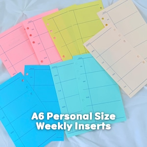 May include: A collection of A6 personal size weekly planner inserts in various colors including pink, yellow, cream, and blue. Each sheet features a grid layout with days of the week printed in black ink and punched holes along the side.