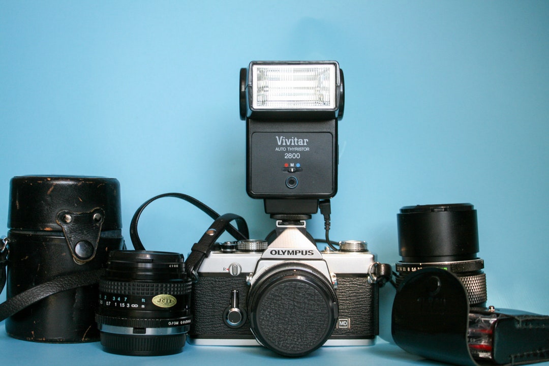 Olympus OM1 Film Camera Bundle Camera, 3 Lenses, 3 Leather Cases and 3