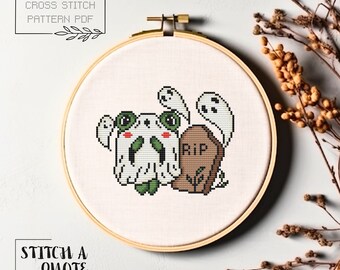 May include: Cross stitch pattern featuring a cute ghost with a skull face and a tombstone that says "RIP". The pattern is in a white embroidery hoop.