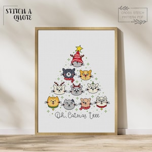 May include: Cross stitch pattern featuring a Christmas tree made of cats. The tree is decorated with a star and baubles. The text "Oh, Catmas Tree" is written below the tree.
