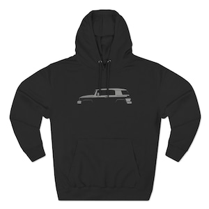 Puede incluir: Sudadera con capucha negra con una silueta gris de un Toyota FJ Cruiser en la parte delantera.