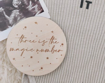 Three is the magic number wooden disc | pregnancy announcement | plaque for bedroom decor | laser engraved wooden disc