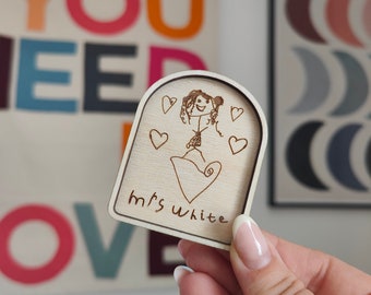 May include: A wooden plaque with a drawing of a person and hearts, with the text "Mrs. White" engraved below.