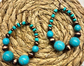 Faux Navajo pearls and turquoise beaded hoop earrings.