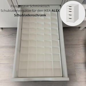 May include: A white plastic drawer organiser insert with a grid of square compartments, designed to fit inside an IKEA ALEX drawer unit. The text Passgenaue Schminktisch Schubladeneinsätze für den IKEA ALEX Schubladenschrank is visible.