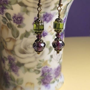 Vintage Boho Inspired handmade dangle Amethyst Facetted and Olvine Cathedral Czech glass beaded Earrings on Antique style ear wires.