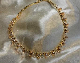 Bridgerton Collection Irridecent Peaches and Cream with Gold Necklace.