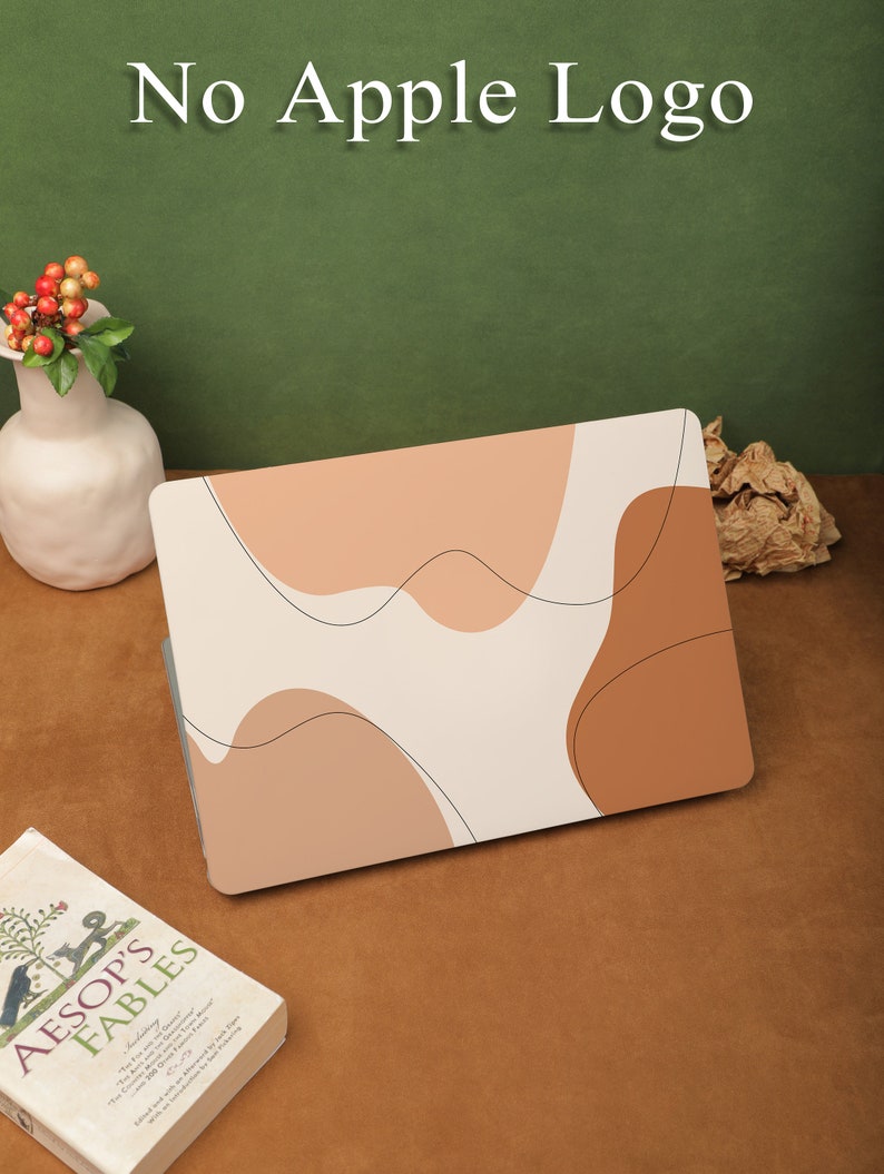 May include: A laptop skin with an abstract design featuring beige, brown, and white colors. The skin has a modern, minimalist aesthetic and is designed to protect the laptop from scratches and wear.