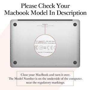 May include: Close-up of the underside of a silver MacBook Pro laptop. The model number, EMC number, and serial number are visible on the label. The label also includes a CE mark and a warning symbol.