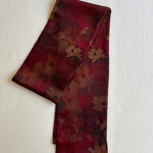 May include: A set of three ceramic mugs with a speckled, matte finish. The mugs are in shades of cream, light gray, and dark gray. Each mug has a simple, minimalist design, perfect for coffee or tea.