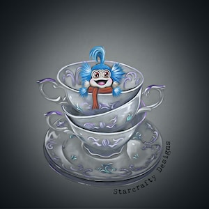 May include: A blue and white fuzzy creature with a red scarf sits inside a stack of three white teacups with purple trim and a white saucer with purple trim. The saucer has a floral design. The text "Starcrafty Designs" is written on the saucer.