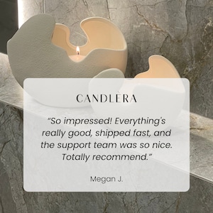 May include: Two off-white, abstract candle holders with a textured finish. One holds a lit candle. The word "CANDLERA" is above a customer review that says "So impressed!"