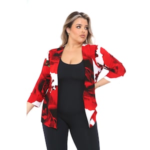 May include: A red and white floral print open front blazer with 3/4 sleeves.