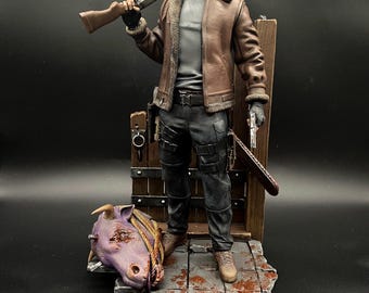 May include: A detailed action figure of a character from the Resident Evil video game series. The figure is wearing a brown leather jacket, a grey shirt, and black trousers. The figure is holding a shotgun and a handgun. The figure is standing on a base with a wooden fence and a severed animal head.