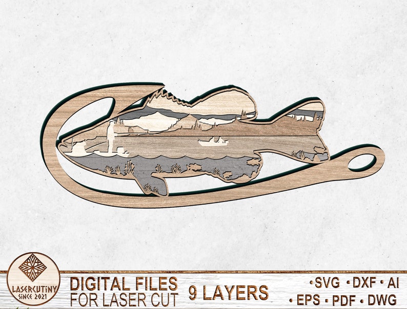 May include: A laser cut wooden fish design with 9 layers. The fish is on a hook and has a scenic background. The design is for laser cutting.