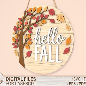 May include: A round wooden sign with the words "hello FALL" in white script. The sign features a tree with colorful fall leaves in shades of red, orange, and yellow. A rope is attached for hanging.