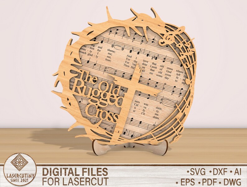 May include: A wooden cutout of a cross with a crown of thorns and musical notes surrounding it. The text "The Old Rugged Cross" is written on the cutout.