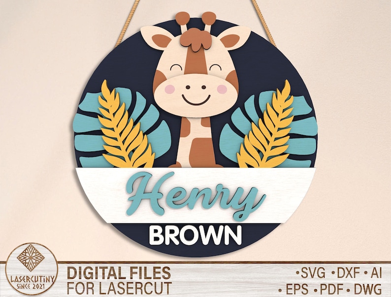 May include: A round wooden sign with a blue background and a white border. The sign features a cartoon giraffe with brown spots and a yellow and blue tropical leaf design. The name "Henry Brown" is written in a white cursive font.