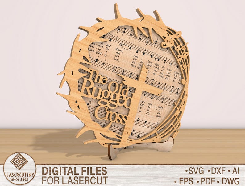 May include: A wooden cutout of a cross with a crown of thorns and music notes. The text "The Old Rugged Cross" is written on the cutout.