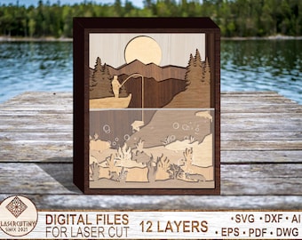 May include: A 12-layer laser cut wooden art piece depicting a fisherman casting a line in a lake with a mountain and sun in the background. The bottom layer shows fish and underwater plants.