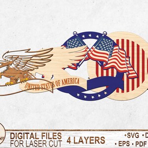 May include: Four-layer laser cut design featuring an American bald eagle with outstretched wings, a banner reading "United States of America", and two crossed American flags with stars and stripes.