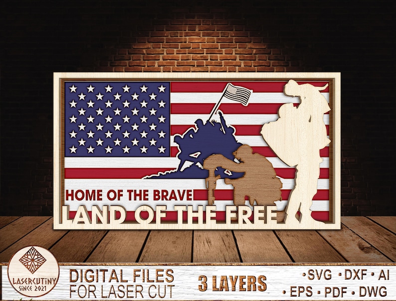 May include: A wooden sign with a layered design featuring an American flag, a soldier kneeling, and a soldier standing. The sign reads "Home of the Brave Land of the Free".