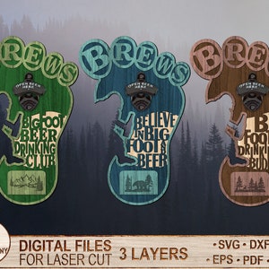Puede incluir: Tres abridores de botellas de madera con tem&aacute;tica de Bigfoot en verde, azul y marr&oacute;n. Cada abridor tiene forma de pie con la palabra "BREWS" en la parte superior. El abridor verde dice "Bigfoot Beer Drinking Club". El abridor azul dice "Believe in Bigfoot & Beer". El abridor marr&oacute;n dice "Bigfoot is my Drinking Buddy."