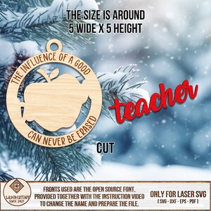 May include: A wooden ornament with a red apple and the text "The influence of a good teacher can never be erased". The ornament is 5 inches wide and 5 inches high. The word "teacher" is written in red cursive lettering.