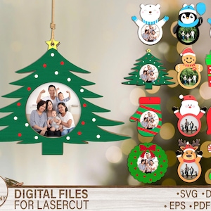 May include: Green wooden Christmas tree ornament with a family photo inside. The tree has red and white dot accents and a gold star at the top. Additional Christmas-themed ornaments are also shown, including a bear, penguin, snowman, and gift.