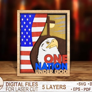 May include: A wooden cutout of an American bald eagle with the words "One Nation Under God" in red, white, and blue. The eagle is standing in front of a wooden cutout of the American flag.