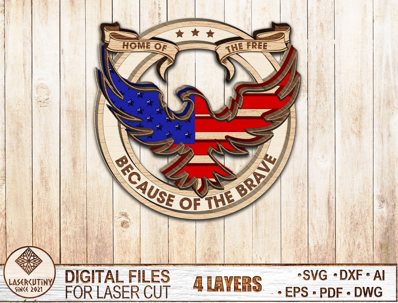 May include: A wooden cutout of an American bald eagle with the words "Home of the Free, Because of the Brave" in a circle around it. The eagle's wings are spread and the eagle is facing forward. The eagle is decorated with the American flag colors of red, white, and blue. The cutout is designed for laser cutting and has 4 layers.