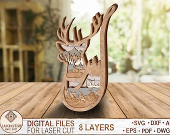 May include: A wooden deer silhouette with a layered design, featuring a forest scene inside. The deer is standing on its hind legs with its head tilted back. The design is made for laser cutting and has 8 layers.