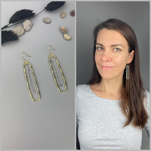 Long earrings of gold colored irregular frame and rhodium plated chain, golden and silver combination