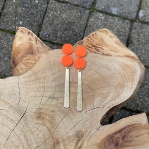 Long dangle earrings of neon orange polymer clay and shiny brass stripes, fimo jewelry, stainless steel nails