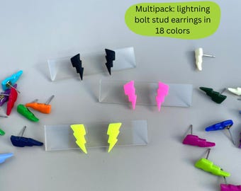 Pode incluir: Uma coleção de brincos de tachas em forma de raio coloridos em várias cores, incluindo preto, rosa e amarelo. A imagem inclui o texto "Multipack: brincos de tachas de raio em 18 cores."