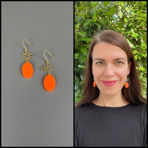 Neon orange earrings of polymer clay and gold plated woven brass knots, fimo jewelry, dangle earrings