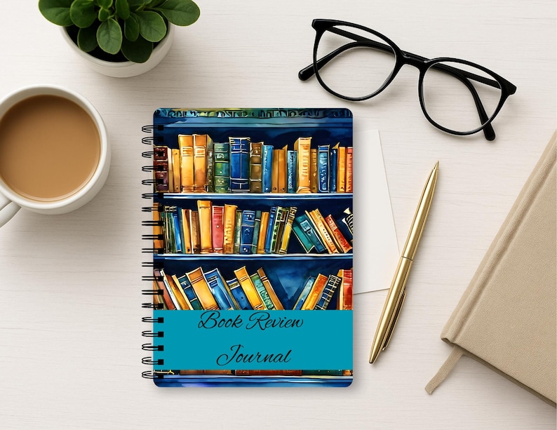 Puede incluir: Un cuaderno de espiral con una colorida ilustraci&oacute;n de estanter&iacute;as llenas de varios libros en su portada. Una banda horizontal de color verde azulado en el centro muestra el texto Book Review Journal en una fuente cursiva oscura.