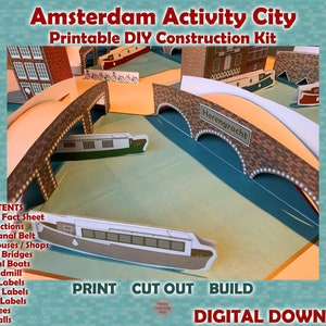 Puede incluir: Un kit de construcción DIY imprimible de una escena de ciudad de canales de Ámsterdam. El kit incluye casas de canales, puentes, barcos, un molino de viento y etiquetas de calle. El texto "Herengracht" es visible en uno de los puentes.