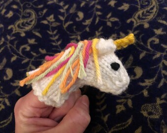 Knitted unicorn finger puppet