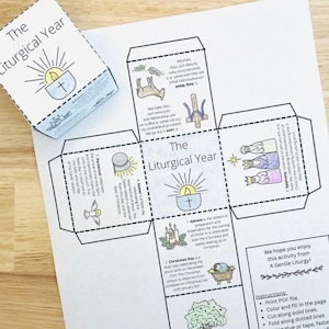 May include: A printable black and white craft for making a cube that teaches about the liturgical year in the Catholic Church. The cube has six sides, each with a different liturgical season: Advent, Christmas, Ordinary Time, Lent, Easter, and Pentecost. The cube also includes a title, "The Liturgical Year", and instructions for assembling the cube.