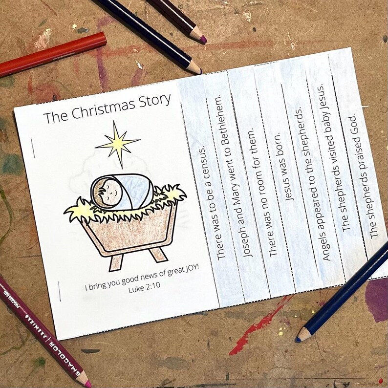 May include: A printable Christmas story activity for kids. The image shows a black and white illustration of baby Jesus in a manger with a star above. The text reads "The Christmas Story" and includes the Bible verse Luke 2:10.