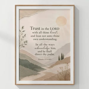May include: A framed wall art print featuring a landscape with layered hills in shades of beige, brown, and sage green. The text reads: Trust in the LORD with all thine heart; and lean not unto thine own understanding. In all thy ways acknowledge him, and he shall direct thy paths. Proverbs 3:5–6 KJV.
