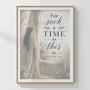 May include: A framed wall art print featuring a woman in a long gown standing by a stone archway. The text reads: For such a TIME as this ESTHER 4:14. The color palette includes soft beige, cream, and muted brown tones with a classic illustration style.