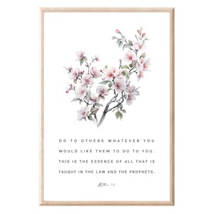 Puede incluir: Una impresión de acuarela con una cita de la Biblia, "Haz a los demás lo que quieras que te hagan a ti. En esto consiste toda la Ley y los Profetas. Mateo 7:12." La cita está rodeada de una delicada pintura de acuarela de una rama de árbol en flor con flores rosas.
